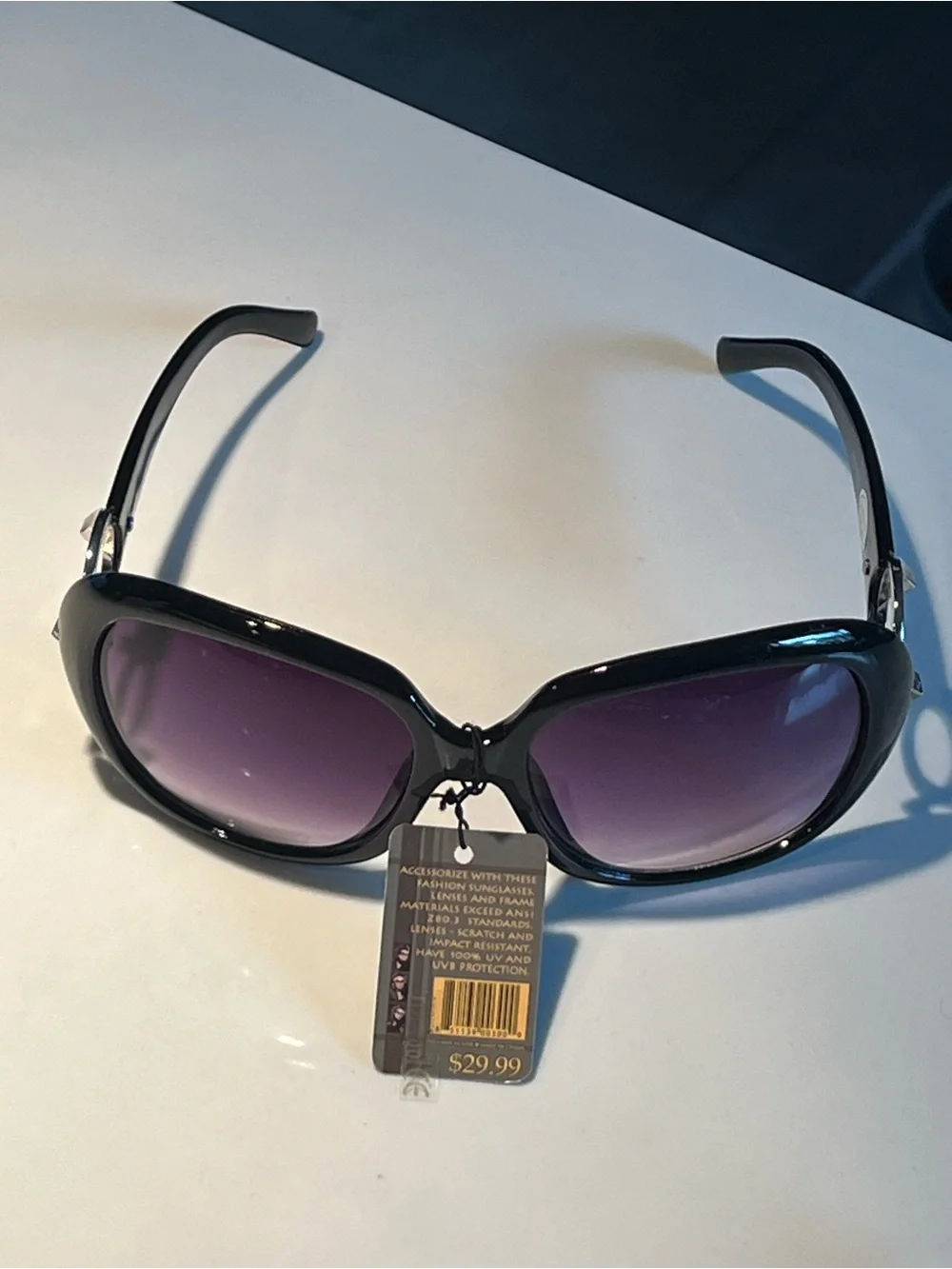 NWT fabulous oversized black sunglasses with violet lenses.
